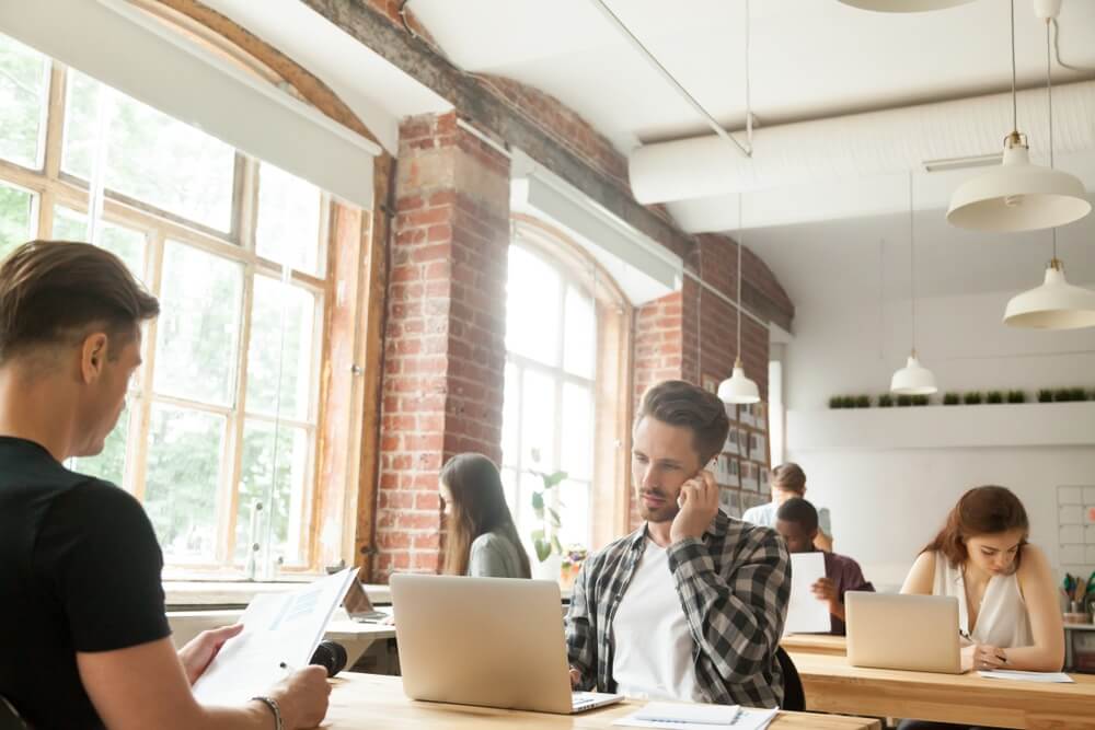 Group of businesspeople working in a shared workspace